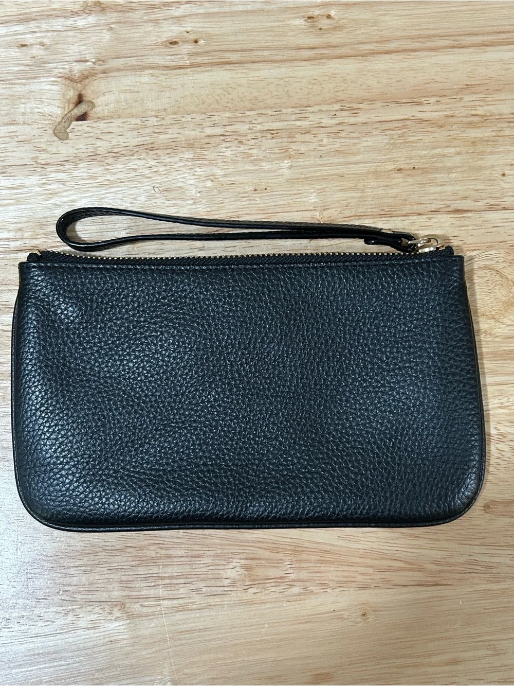 kate spade black pebbled leather wristlet with gold-tone logo